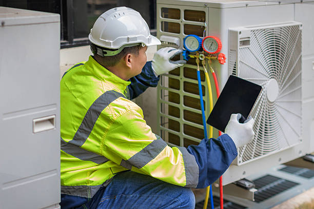 Professional Heat Pump Repair technician working in Laton, CA